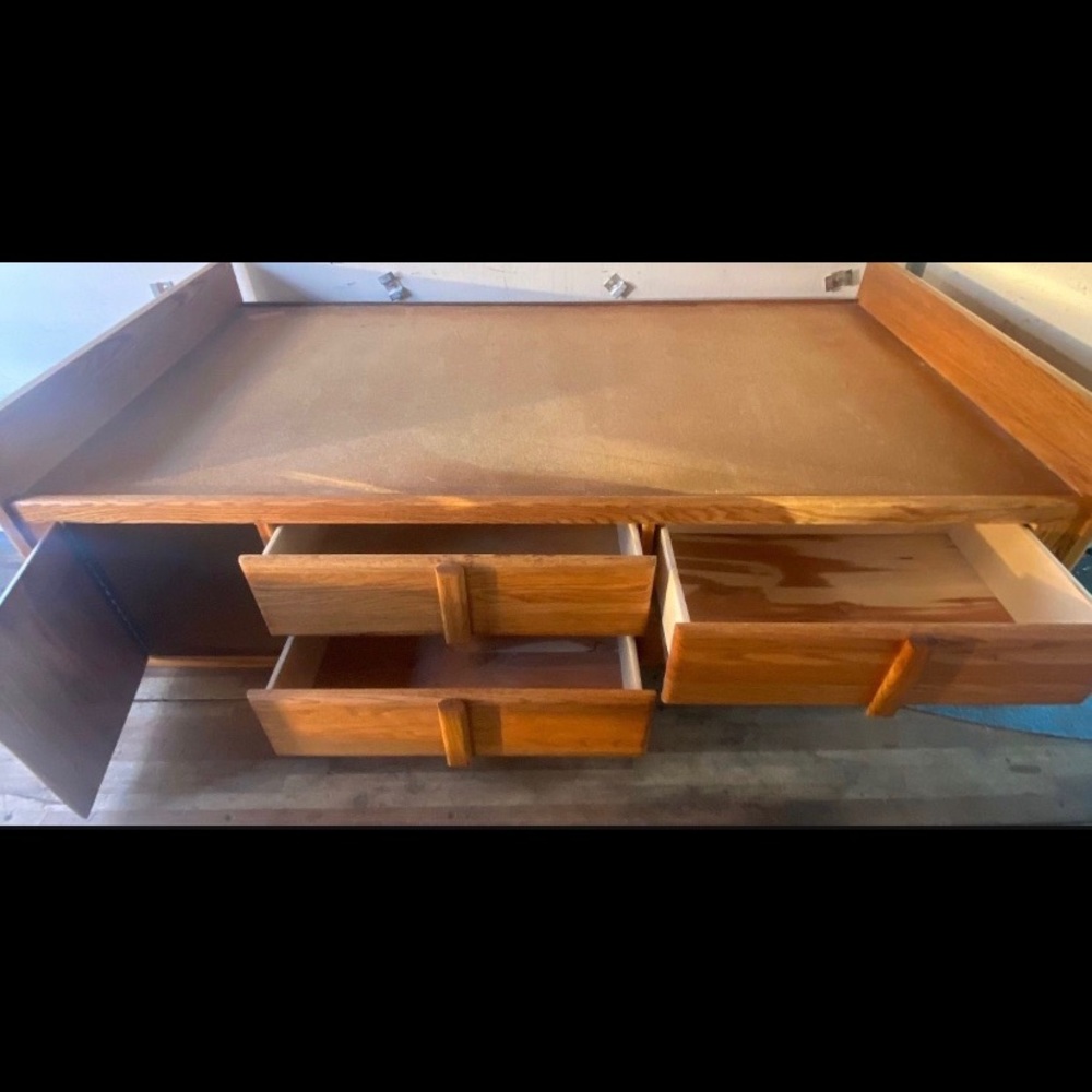 Bedroom set with twin bed, dressers, and mirror.